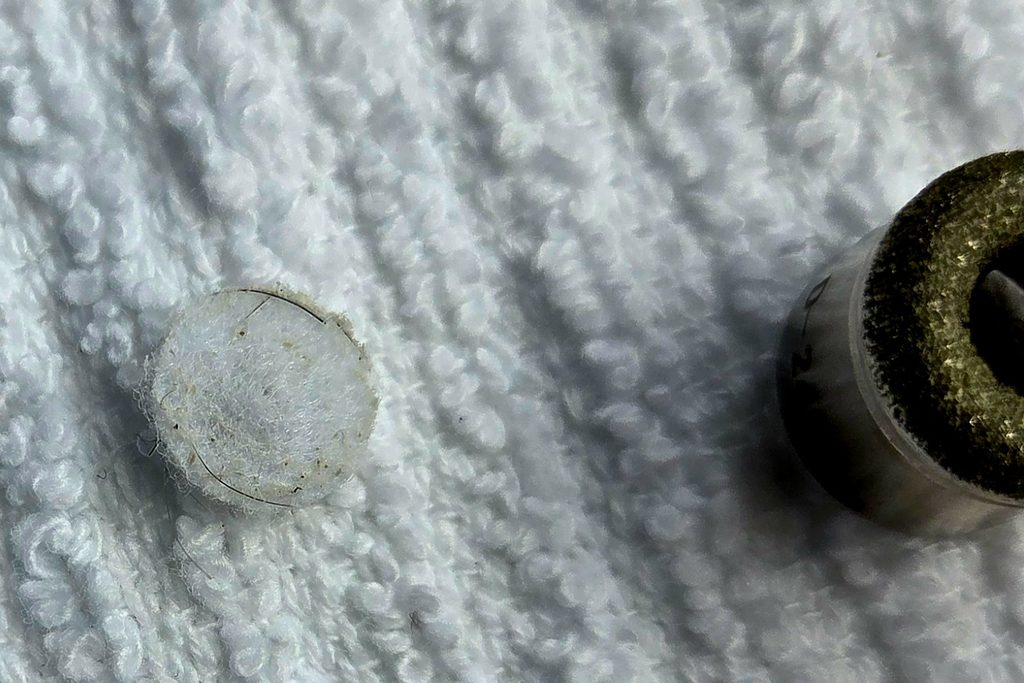 Microdermabrasion filter showing dead skin cells and surface debris after treatment